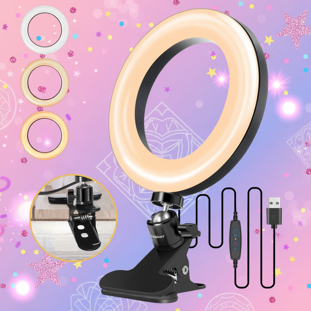 A black clip-on ring light with a warm white illuminated ring, shown with its USB cable, inline switch, and a circular inset demonstrating the clip on a phone. The background is a colorful, sparkly pink and purple graphic.