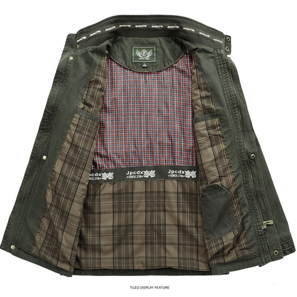 An open dark olive green jacket displayed flat against a white background, showing a brown and beige plaid lining and a red, blue, and white plaid inner shirt.