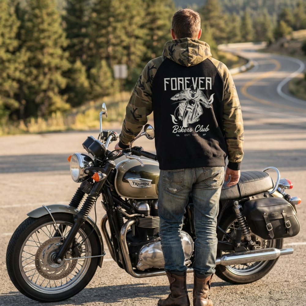 A black and camouflage raglan hoodie shown from the back, featuring a large white graphic of a motorcycle with a rider and the text 'FOREVER Bikers Club'.