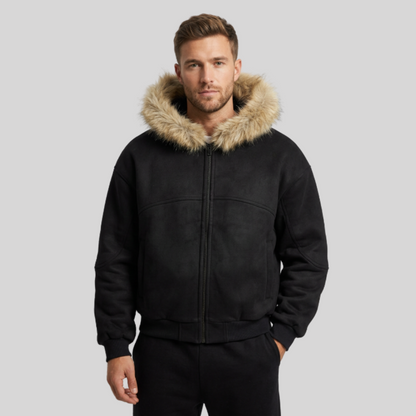A black zip-up jacket with a large tan faux-fur trimmed hood, shown flat against a solid white background.
